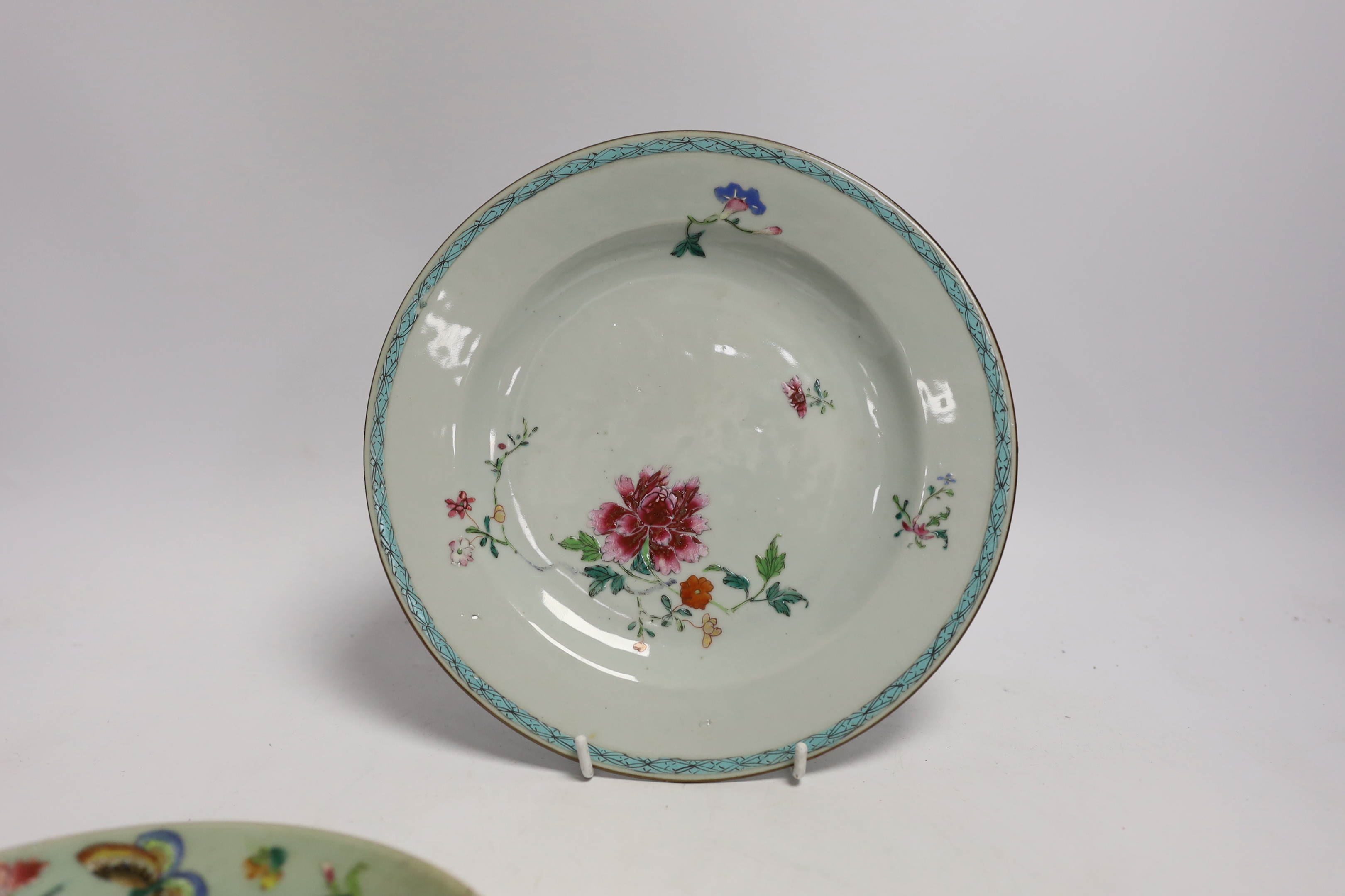 An 18th century Chinese export famille rose plate, 23cm diameter, and two 19th century celadon famille rose plates